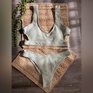 Green 2 piece swimsuit, never used, excellent condition